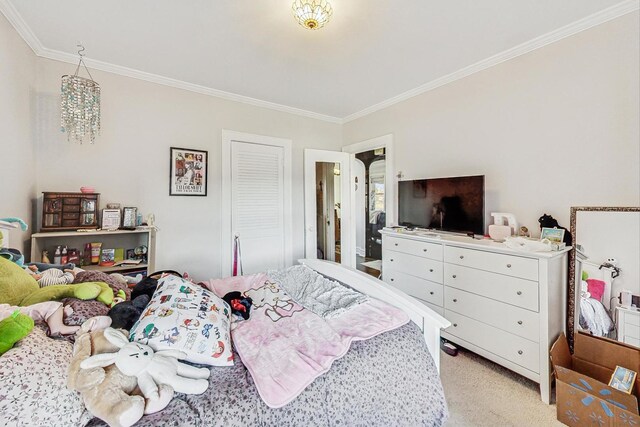 bedroom featuring ornamental molding and light carpet