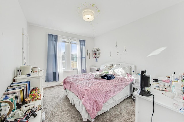 bedroom with light colored carpet