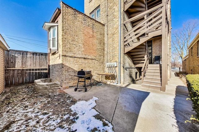 view of patio featuring grilling area and fence