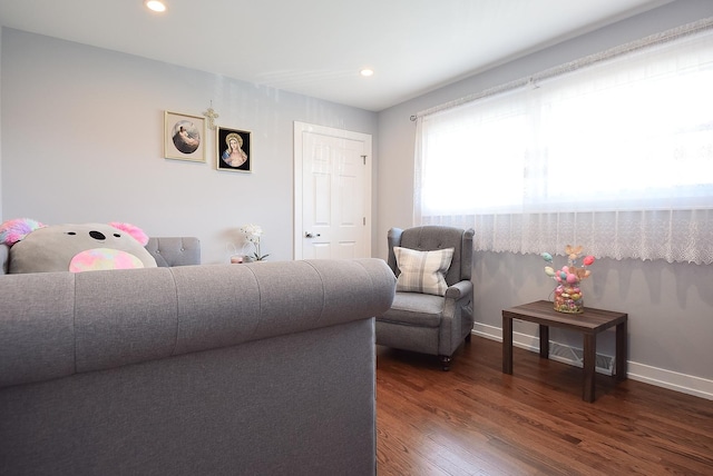 living room with baseboards, recessed lighting, and wood finished floors