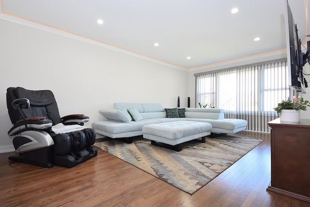 living area with crown molding, recessed lighting, and wood finished floors