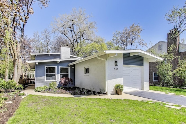 537 County Line Rd, Highland Park, IL 60035 - mid-century inspired home with a chimney, a front yard, driveway, and brick siding