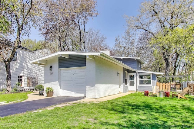 537 County Line Rd, Highland Park, IL 60035 - mid-century home with brick siding, asphalt driveway, a chimney, and a garage