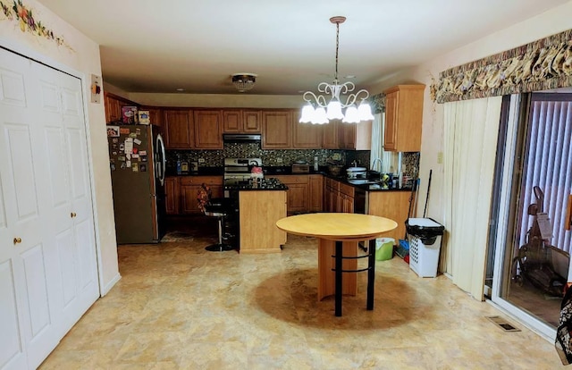 18507 Indie Ct, Hazel Crest, IL 60429 - kitchen with appliances with stainless steel finishes, a sink, extractor fan, a center island, and dark countertops