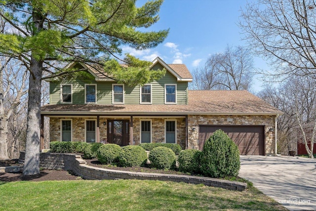 view of front of property with a shingled roof, a garage, stone siding, and driveway