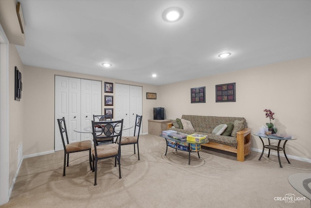 living room featuring recessed lighting, carpet flooring, and baseboards