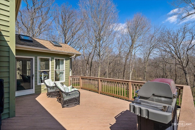 wooden terrace featuring grilling area