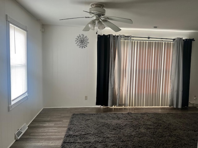 14701 E Riverside Dr, South Holland, IL 60473 - unfurnished room with wood finished floors, healthy amount of natural light, a ceiling fan, and baseboards
