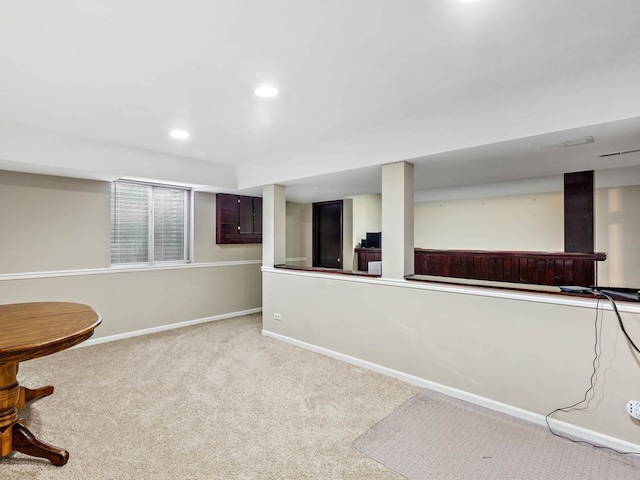 below grade area with recessed lighting, carpet, and baseboards