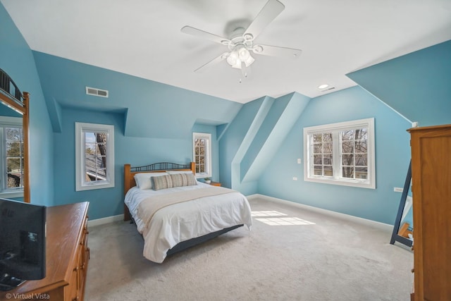 carpeted bedroom featuring vaulted ceiling, visible vents, baseboards, and multiple windows