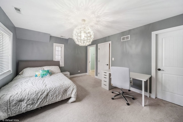 carpeted bedroom featuring visible vents, baseboards, and an inviting chandelier