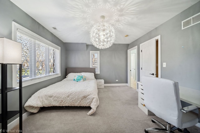 carpeted bedroom featuring baseboards, visible vents, and a notable chandelier