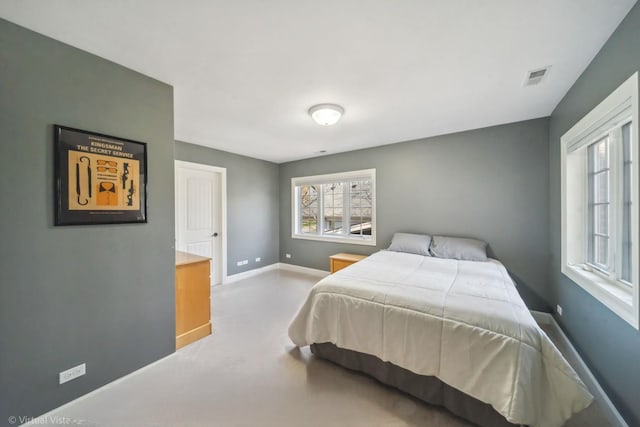 bedroom featuring visible vents and baseboards