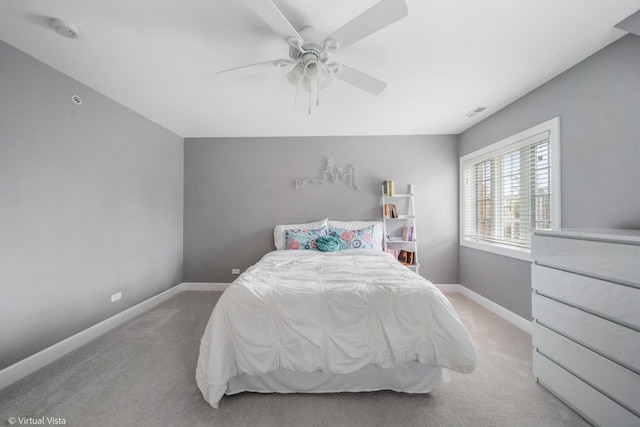 bedroom featuring visible vents, a ceiling fan, baseboards, and carpet floors