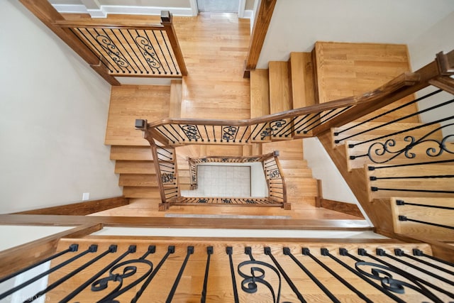 staircase with wood finished floors