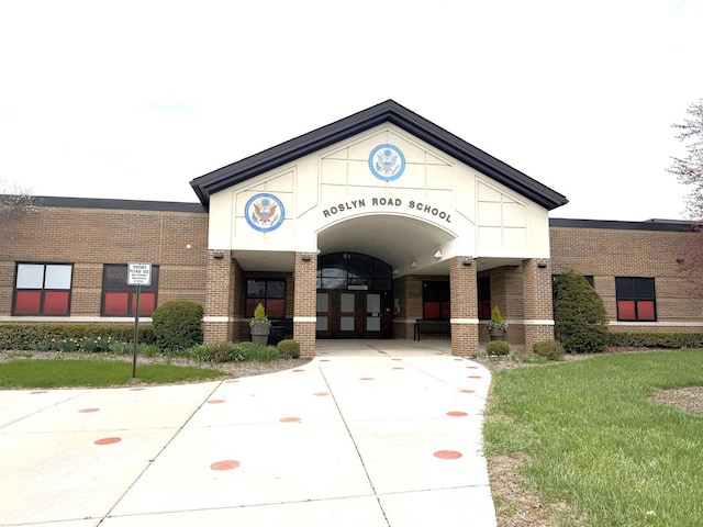 view of building exterior with concrete driveway