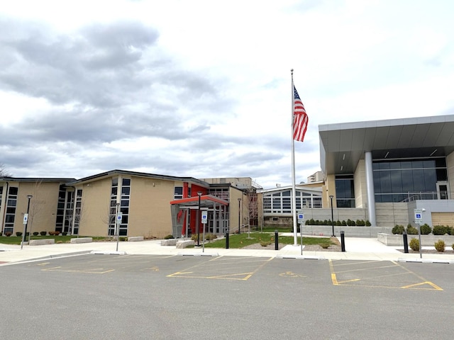 view of property featuring uncovered parking