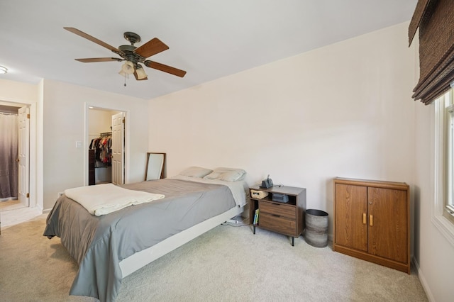2806 Brindle Ct, Northbrook, IL 60062 - bedroom with light colored carpet, a walk in closet, a ceiling fan, and a closet