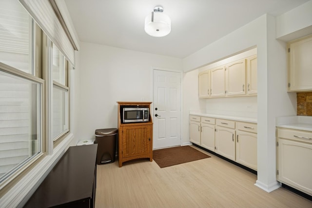 2806 Brindle Ct, Northbrook, IL 60062 - kitchen with stainless steel microwave, light wood finished floors, and light countertops