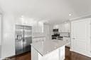 kitchen featuring light countertops, white cabinetry, and a kitchen island