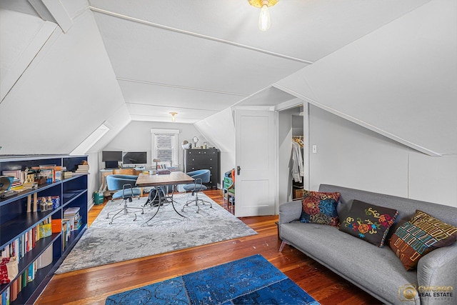 home office with hardwood / wood-style flooring and vaulted ceiling