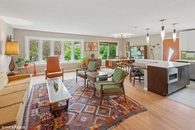 9835 Keeler Ave, Skokie, IL 60076 - living room with light wood-type flooring and baseboards