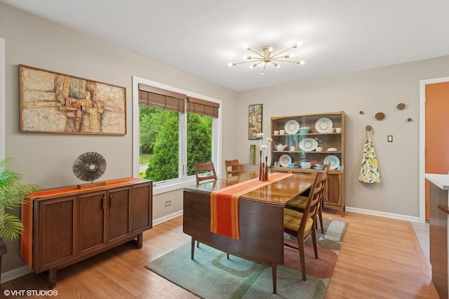9835 Keeler Ave, Skokie, IL 60076 - dining room featuring a chandelier and light wood-style floors