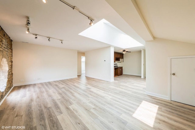 400 Mccarthy Rd Unit 421, Lemont, IL 60439 - unfurnished living room featuring rail lighting, light wood-style floors, and baseboards