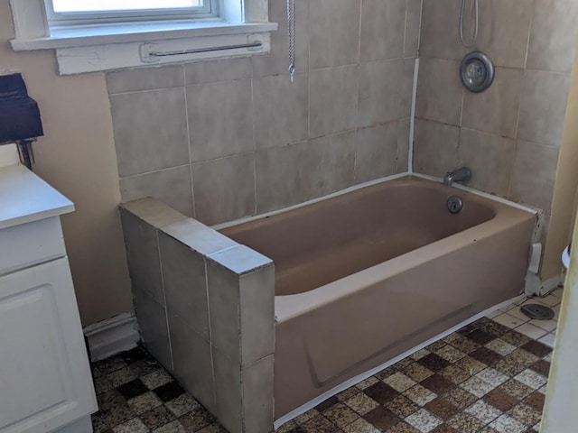 full bath with tile patterned floors, vanity, and shower / bathtub combination