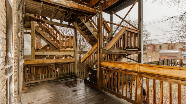 wooden terrace featuring stairs