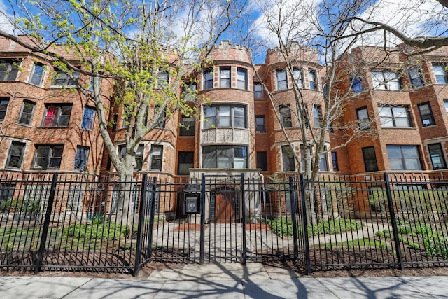 view of building exterior with a fenced front yard