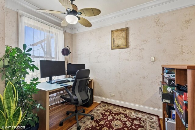 office area with baseboards, a ceiling fan, wood finished floors, and crown molding