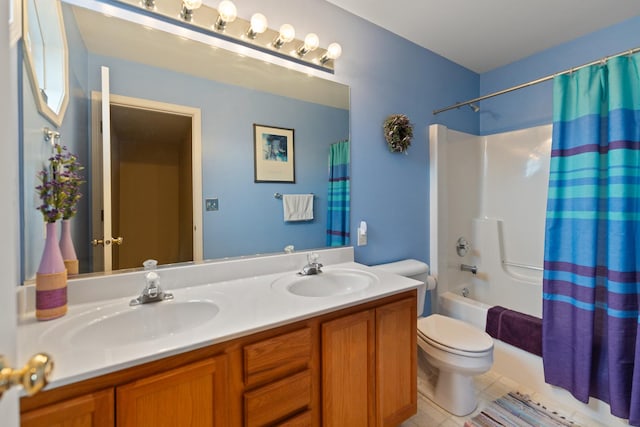 full bath with shower / tub combo, a sink, double vanity, and toilet
