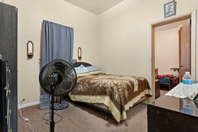 bedroom featuring baseboards and carpet floors