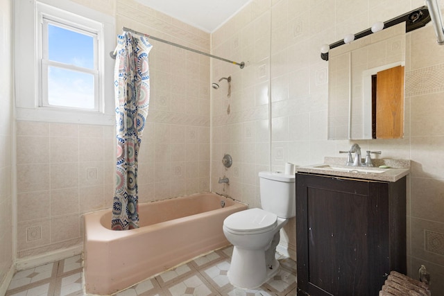 bathroom featuring shower / bath combo, tile walls, toilet, vanity, and tile patterned floors