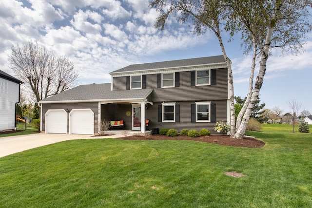 view of front of house featuring driveway, a front lawn, and a garage