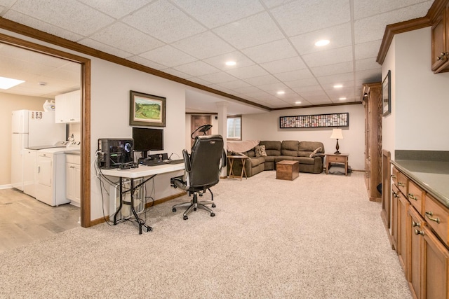 office space with baseboards, light colored carpet, recessed lighting, a paneled ceiling, and independent washer and dryer