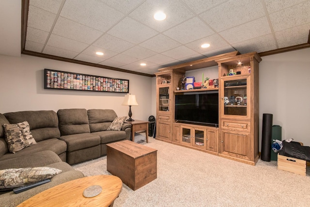 living area featuring light colored carpet, recessed lighting, crown molding, and a drop ceiling