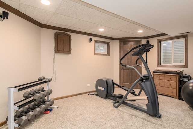 exercise room with visible vents, crown molding, carpet floors, baseboards, and recessed lighting