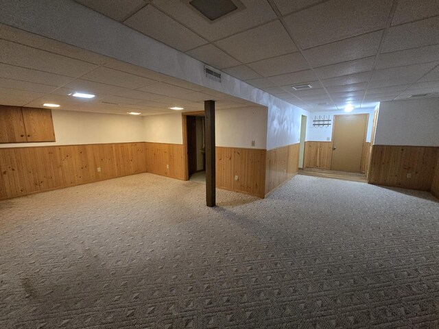 31-3 Lake Carroll Blvd, Lake Carroll, IL 61046 - foyer with baseboard heating, wooden walls, healthy amount of natural light, light wood finished floors, and wood ceiling