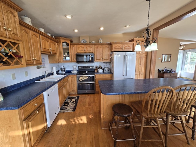31-3 Lake Carroll Blvd, Lake Carroll, IL 61046 - kitchen featuring range with two ovens, black microwave, high end refrigerator, dishwasher, and wood finished floors