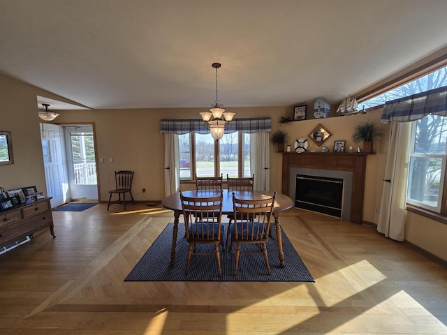 31-3 Lake Carroll Blvd, Lake Carroll, IL 61046 - dining space with a fireplace and a chandelier