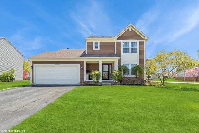 9972 Chetwood Dr, Huntley, IL 60142 - traditional-style house with asphalt driveway, an attached garage, a front lawn, covered porch, and a shingled roof