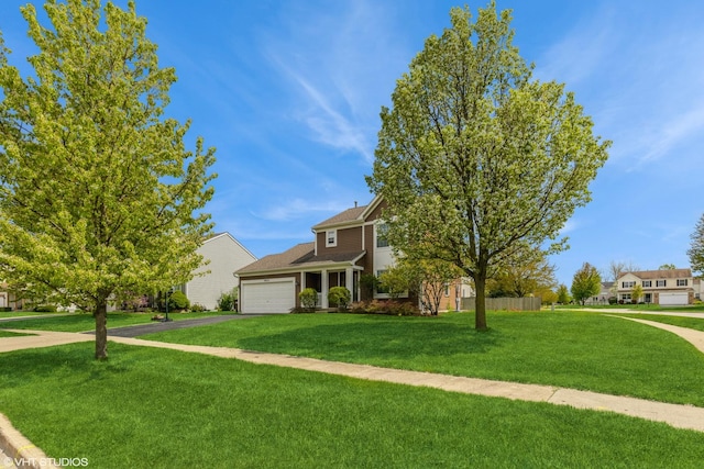 9972 Chetwood Dr, Huntley, IL 60142 - view of front facade with an attached garage, asphalt driveway, and a front yard