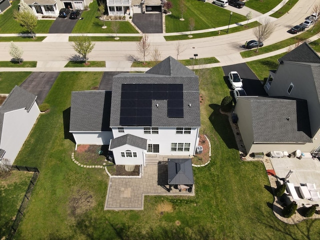 birds eye view of property with a residential view