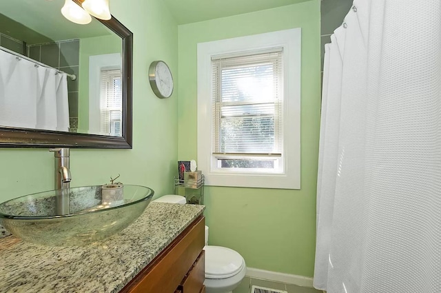 bathroom with toilet, vanity, baseboards, and a shower with curtain