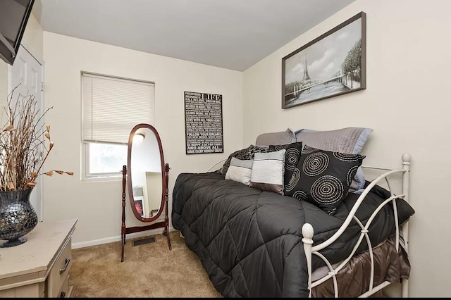 bedroom with baseboards and carpet floors