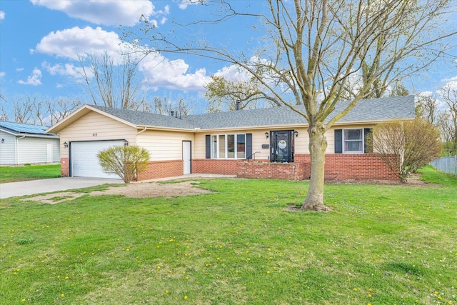 415 E 14th St, Gibson City, IL 60936 - single story home featuring brick siding, a front lawn, driveway, and a garage