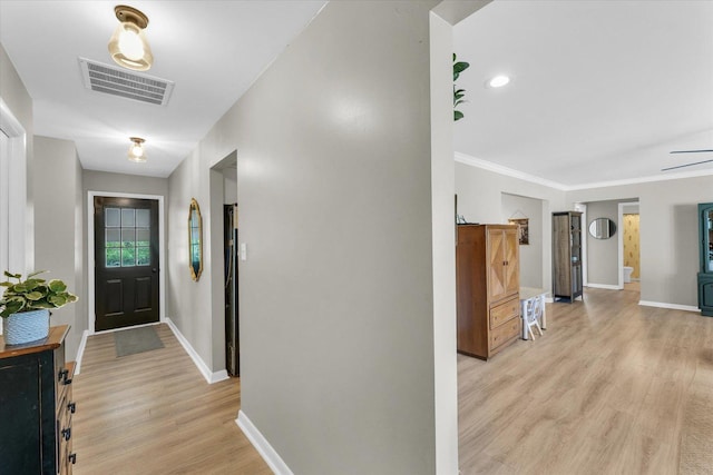 415 E 14th St, Gibson City, IL 60936 - corridor with light wood-style floors, visible vents, baseboards, and ornamental molding