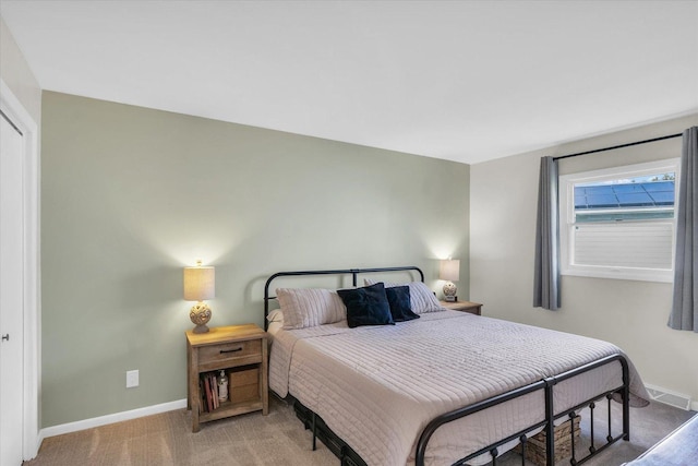 415 E 14th St, Gibson City, IL 60936 - bedroom with visible vents, carpet flooring, and baseboards